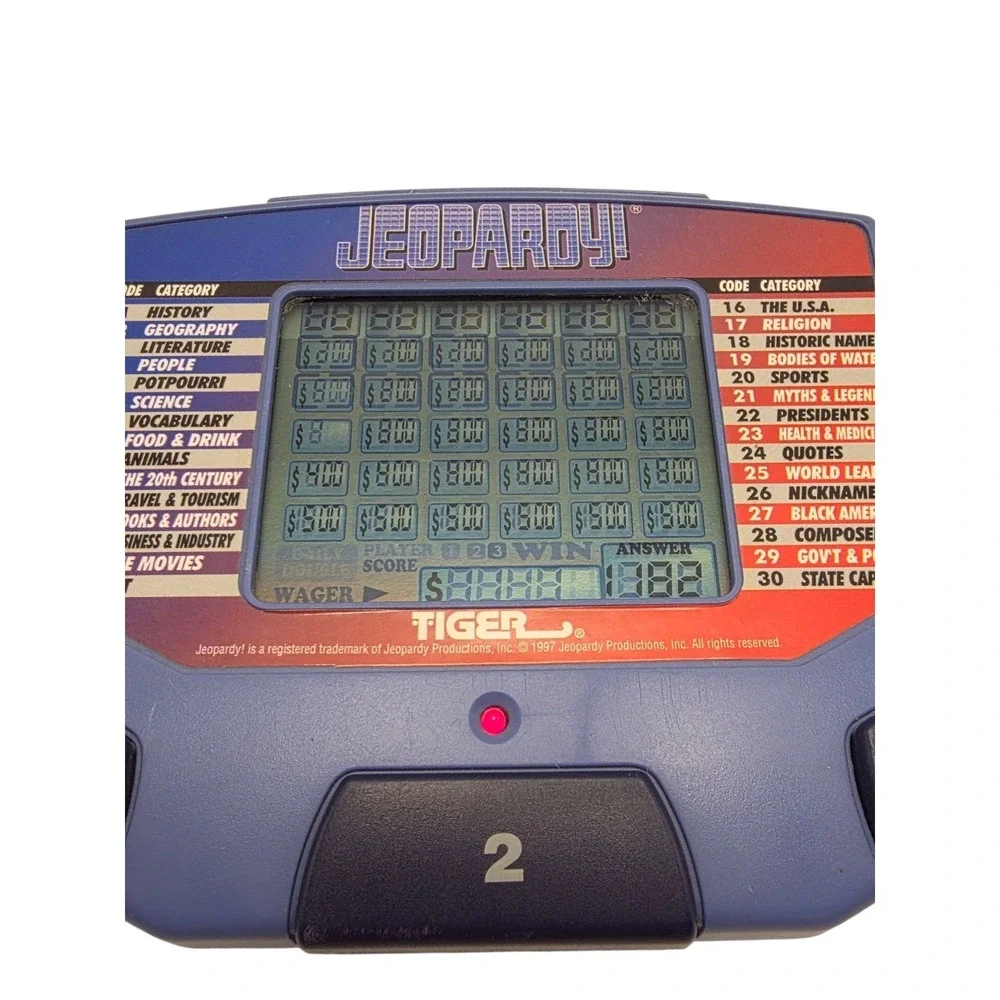 Tiger Electronics Jeopardy Hand Held Game With Cartridges & Answer Question Book